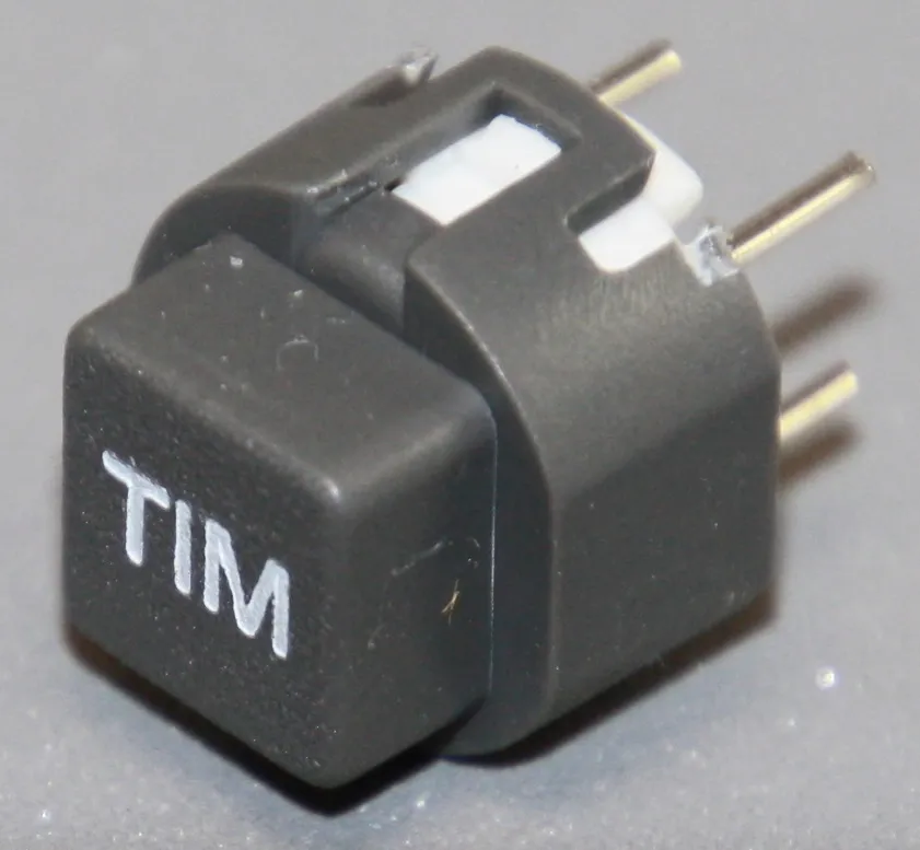 Tryktast med påskrift ""TIM""