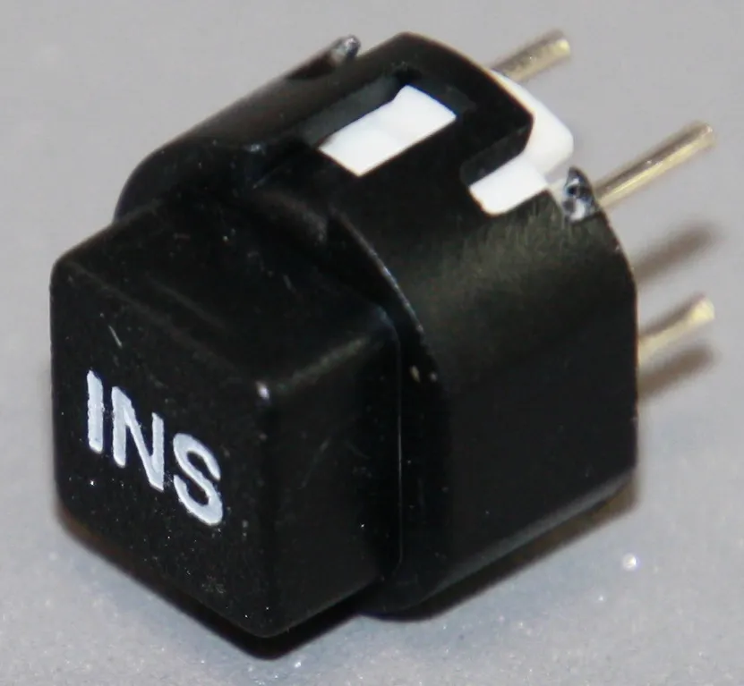 Tryktast med påskrift ""INS""